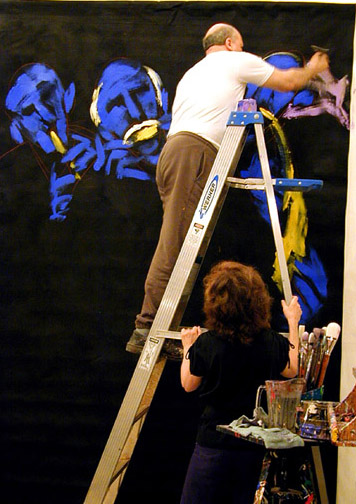 Photo of Artist E.J. Gold painting a JazzArt panel for the Mondavi Center Concert by Delfeayo Marsalis